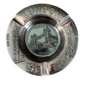 vintage metal souvenir ashtray featuring prominent London landmarks.